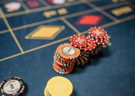 casino chips stacked on a roulette table - can casinos refuse to pay out winnings guide