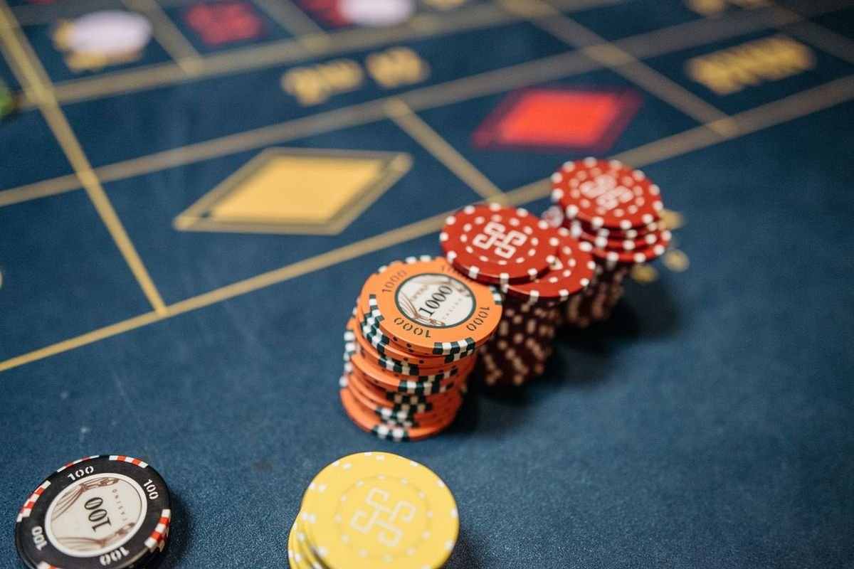 casino chips stacked on a roulette table - can casinos refuse to pay out winnings guide