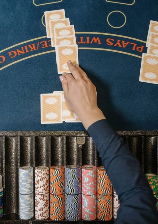 blackjack table with cards and chips - blackjack hand signals guide